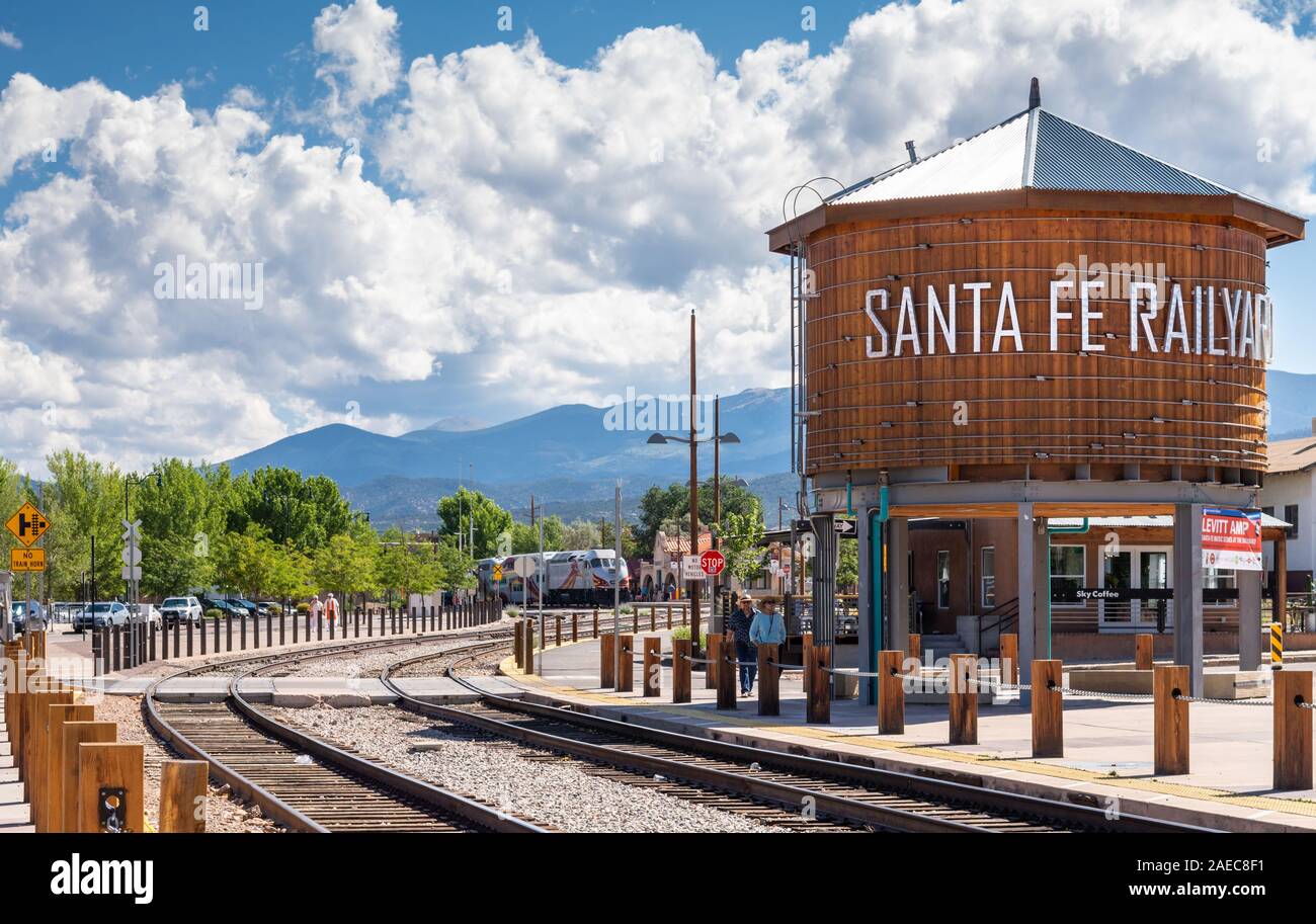 Santa Fe Railyard, Rail Runner train and Sangre de Cristo mountains, New Mexico, USA. Stock Photo