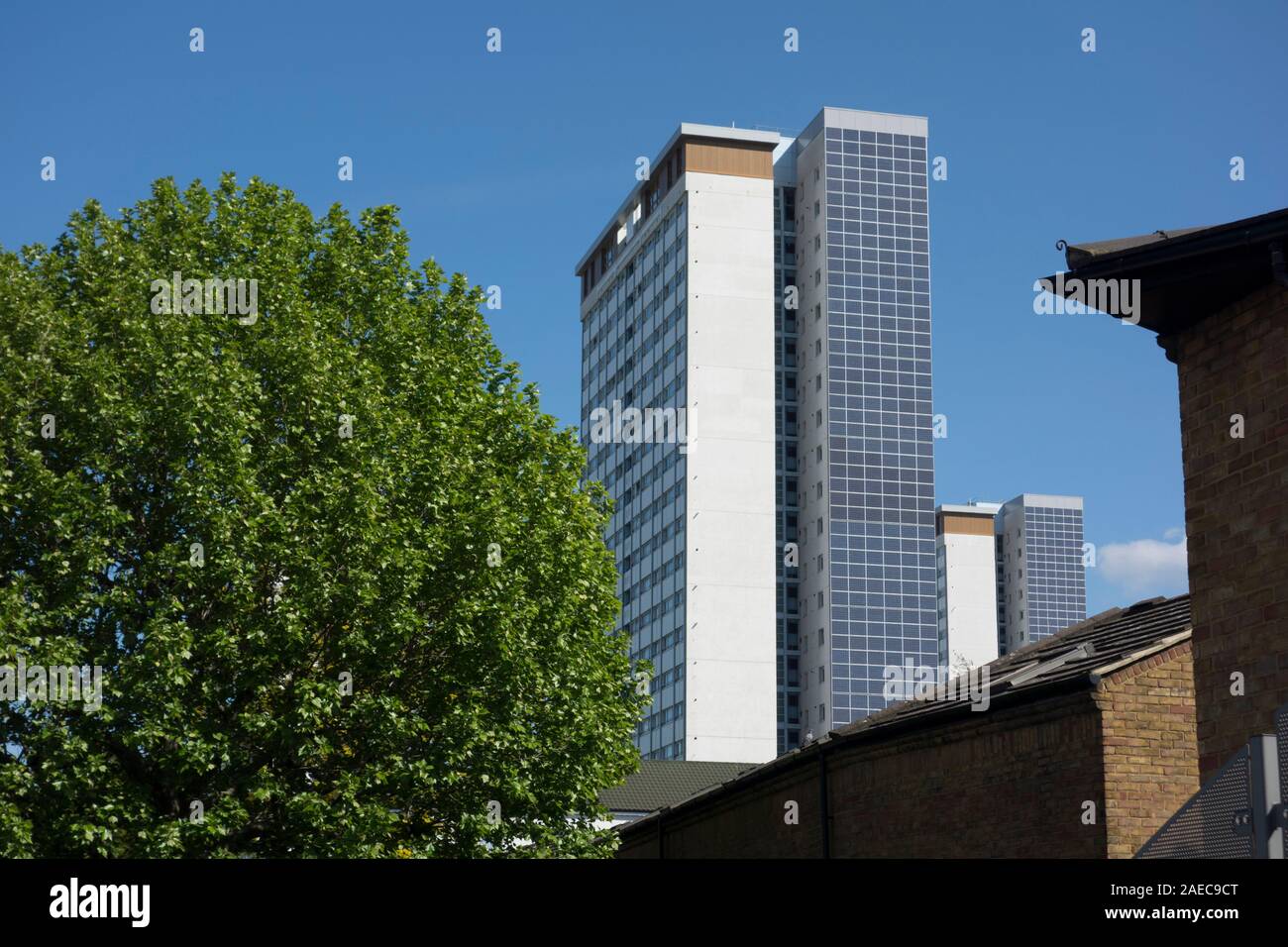 Solar panels on Norland House, high-rise tower block, Edward Woods Estate, Hammersmith and Fulham, London, UK Stock Photo