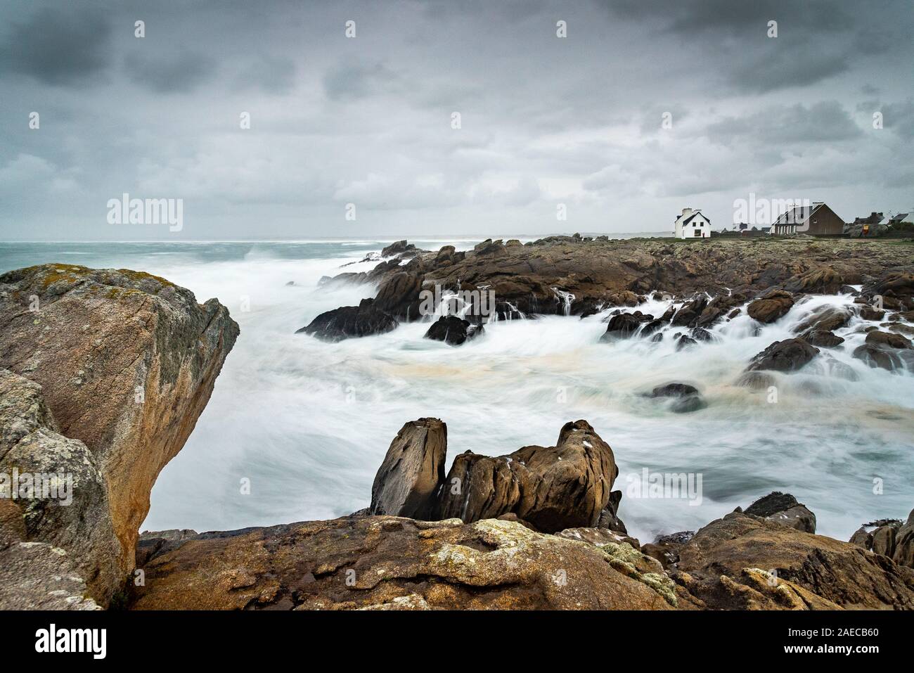 Long exposure on a storm on the coast in Brittany. The foam of the ...