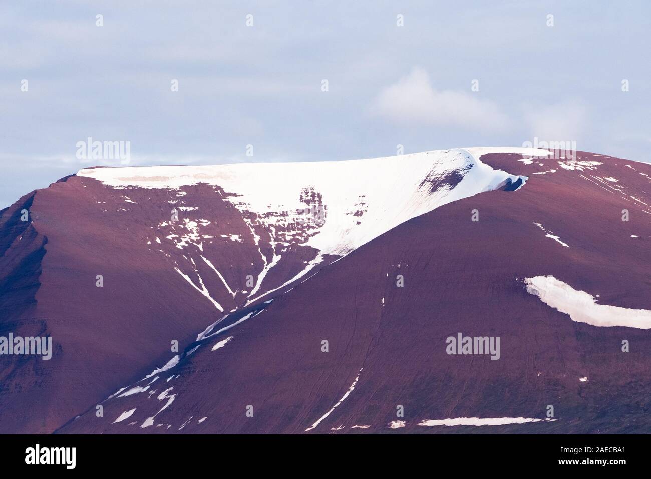 A mountain range that contains iron Minerals. Photographed Spitzbergen, Svalbard Islands, Norway Stock Photo