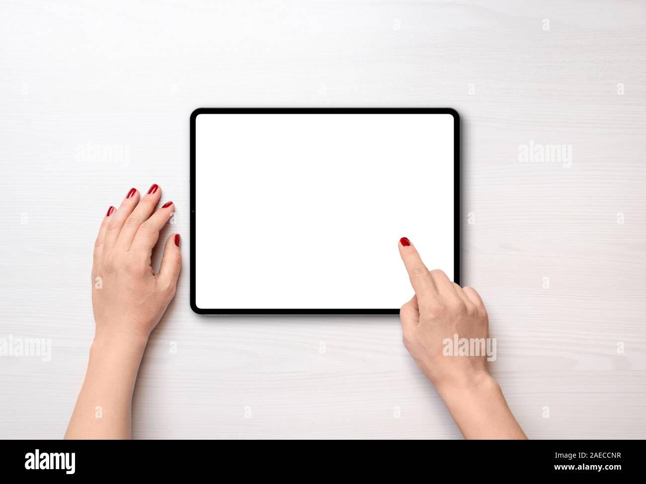 Tablet on desk in horizontal position and isolated screen for mockup