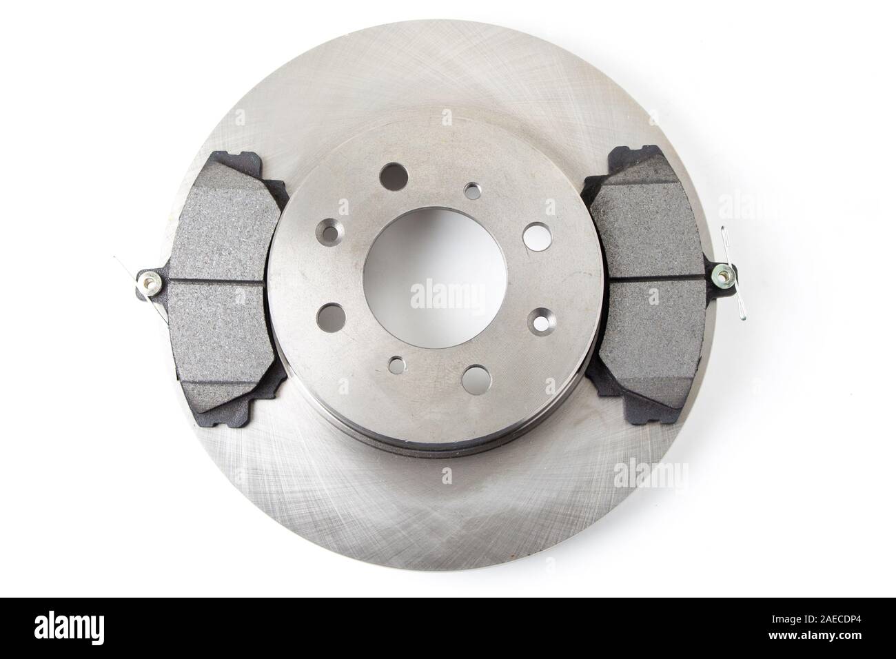 Brake pads and brake discs for cars isolated on white background. New