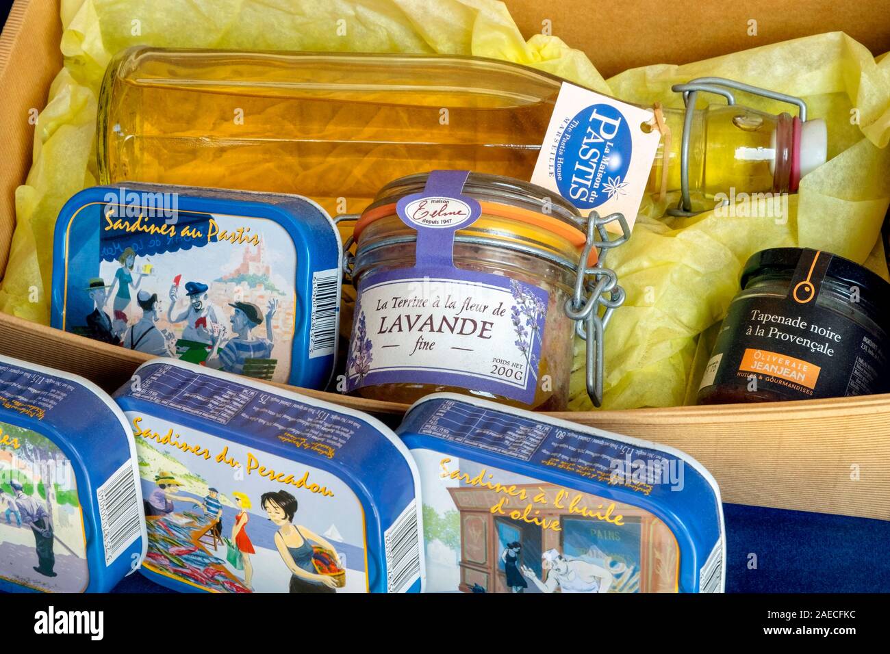 Bottle of Pastis with canned sardines and jars of lavande and tapenade, La Maison du Pastis, Vieux Port, Marseille, France, Europe Stock Photo