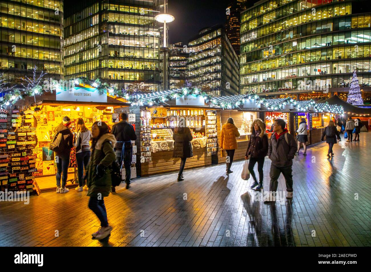 London, Christmas market at the Thames, near Tower Bridge, Christmas by the river, Ufer Promenade, office building at the eastern Thames shore, Great Stock Photo
