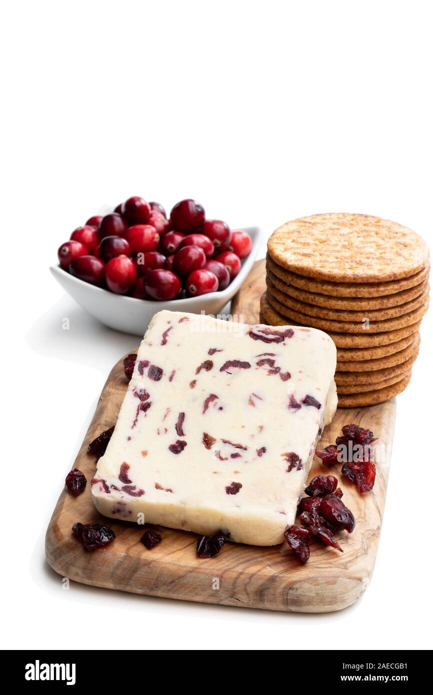 Cranberry cheddar cheese with wheat crackers isolated on white Stock