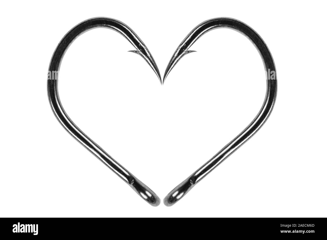 Fishing hook love heart sign isolated on a white background. Fishing hook  close up. Fishing tackle. Stainless steel fishing hooks. Fish hooks in  heart Stock Photo - Alamy