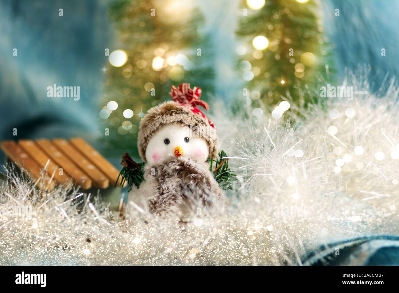 Toy snowman with festive Christmas holiday background Stock Photo