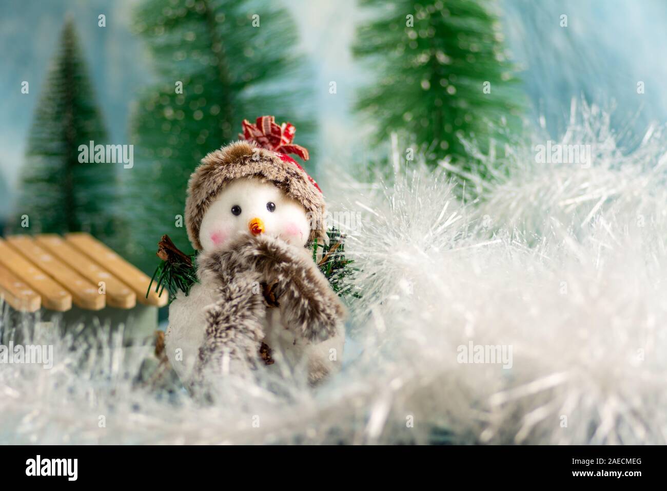 Toy snowman with festive Christmas holiday background Stock Photo