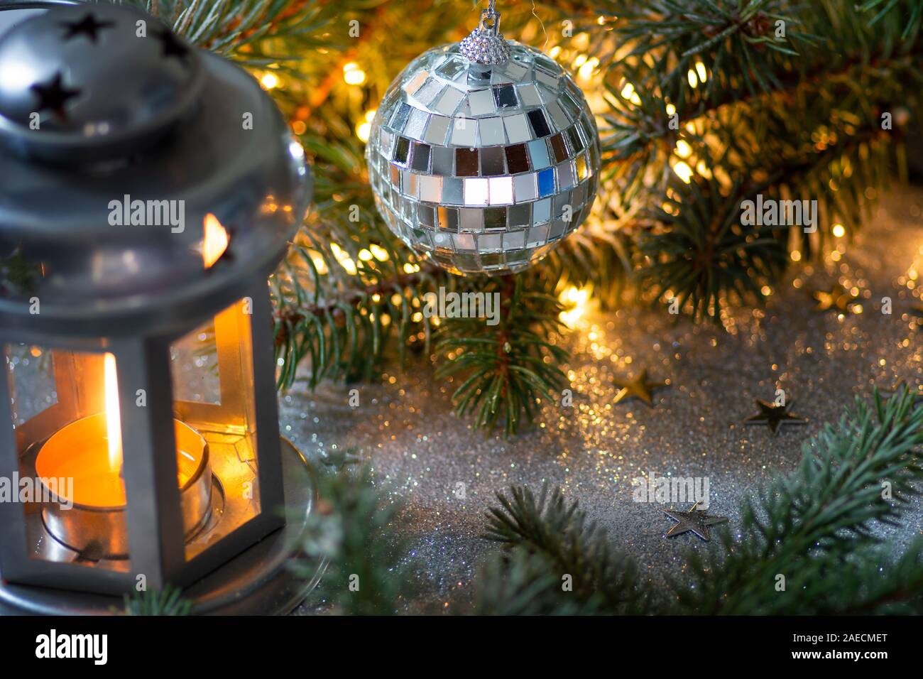 Festive lantern and Christmas decorations against shiny background Stock Photo