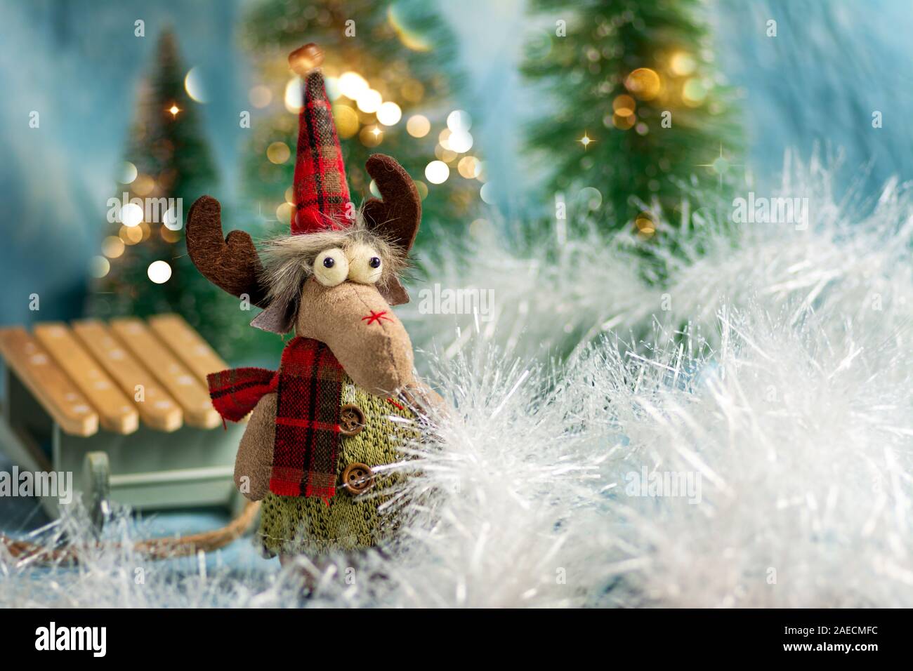 Toy Reindeer with festive Christmas holiday background Stock Photo