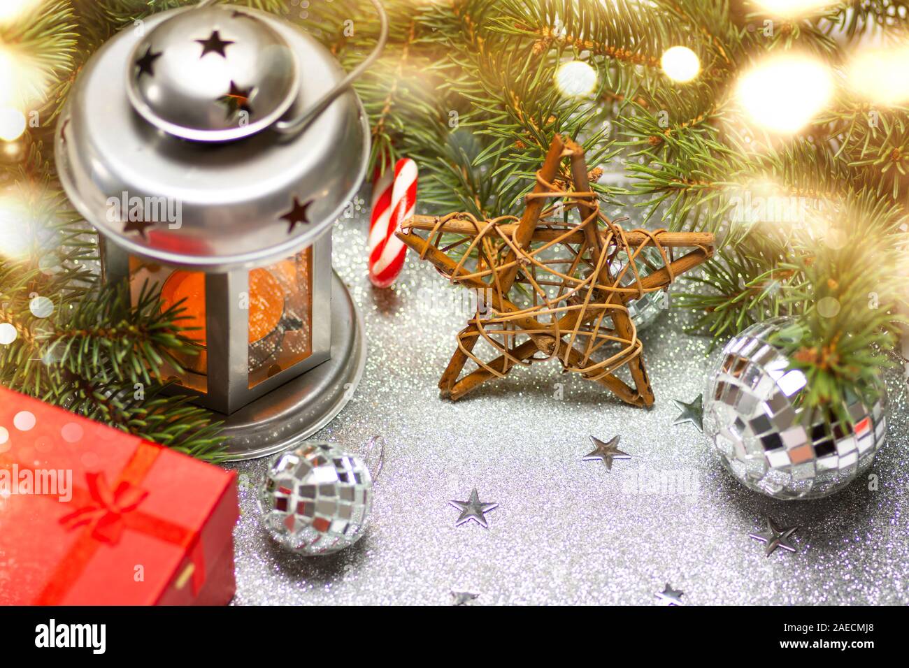 Festive lantern and Christmas decorations against shiny background Stock Photo