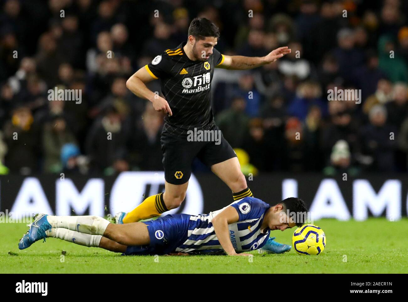 Wolverhampton Wanderers' Lomba Pedro Neto and Brighton and Hove Albion's Steve Alzate during the Premier League match at the Amex Stadium, Brighton. Stock Photo