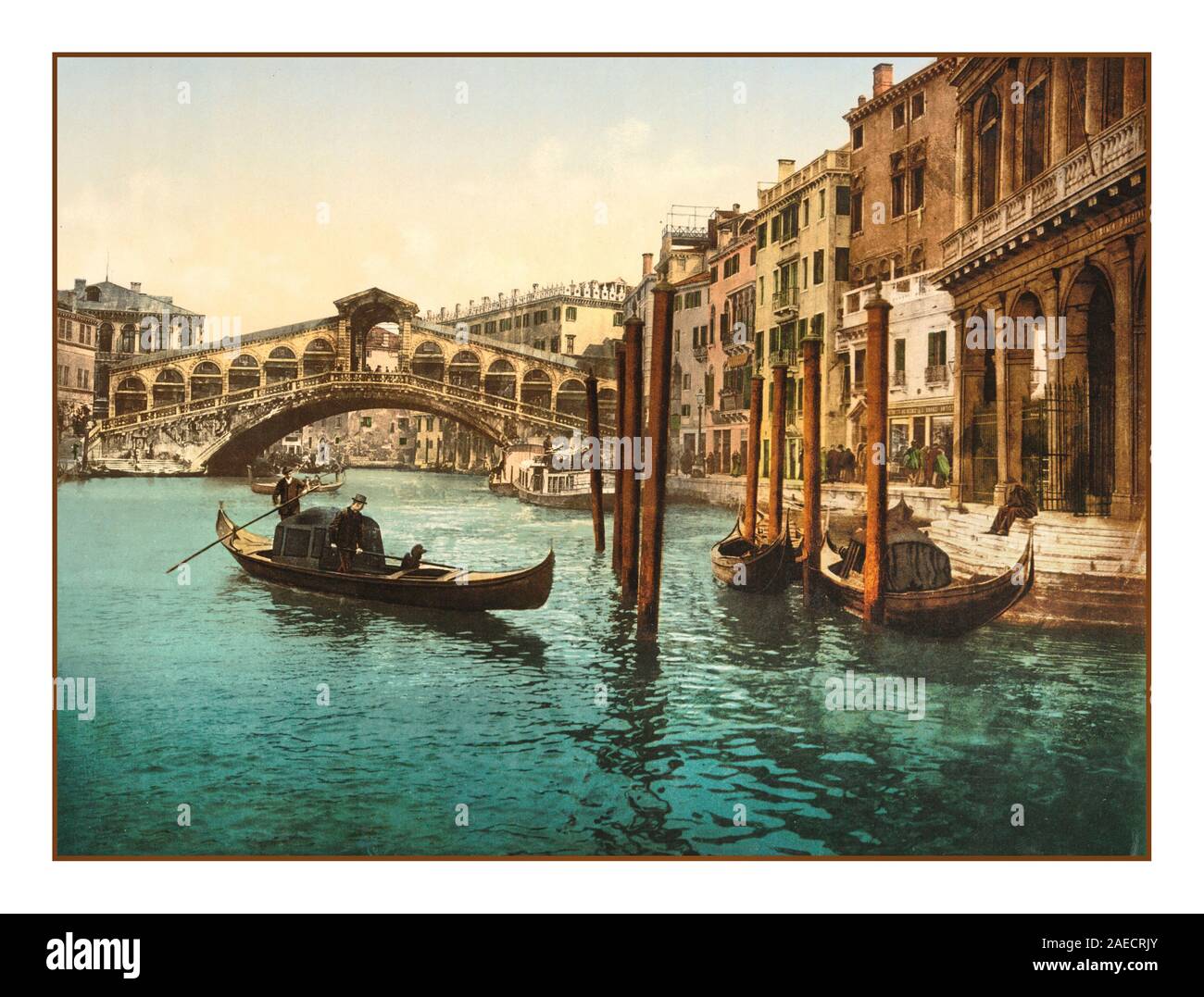 VENICE RIALTO BRIDGE VINTAGE OLD PHOTOCHROM 1890-1900’s Historic Vintage old image of The Rialto Bridge, Venice, Italy 1890 Using post colouring technique via transfer onto lithographic printing plates from Black and White negative images, producing pleasing evocative creative artwork images The Rialto Bridge, Venice, Italy 1890 Stock Photo