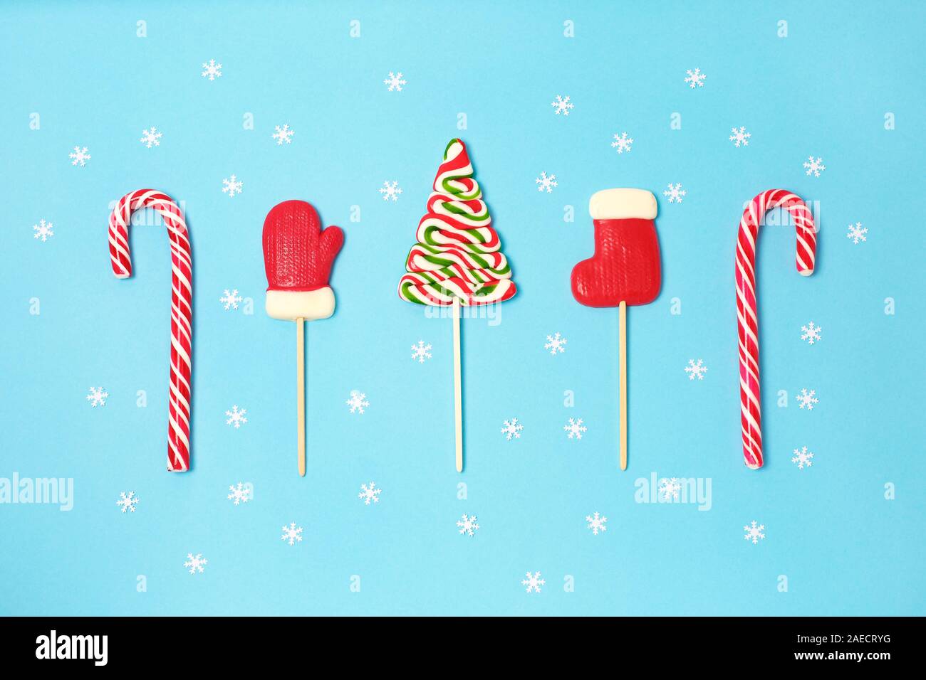 Christmas Candies And Little White Snowflake On Blue Background Candy Shapes Candy Cane Flat Lay Top View Copy Space Stock Photo Alamy