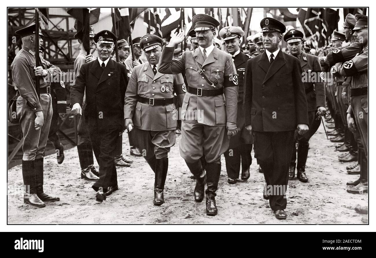 Vintage 1930's Nazi Parade Adolf Hitler taking salute from troops at a naval facility ceremony with Martin Bormann on his right side Germany Stock Photo