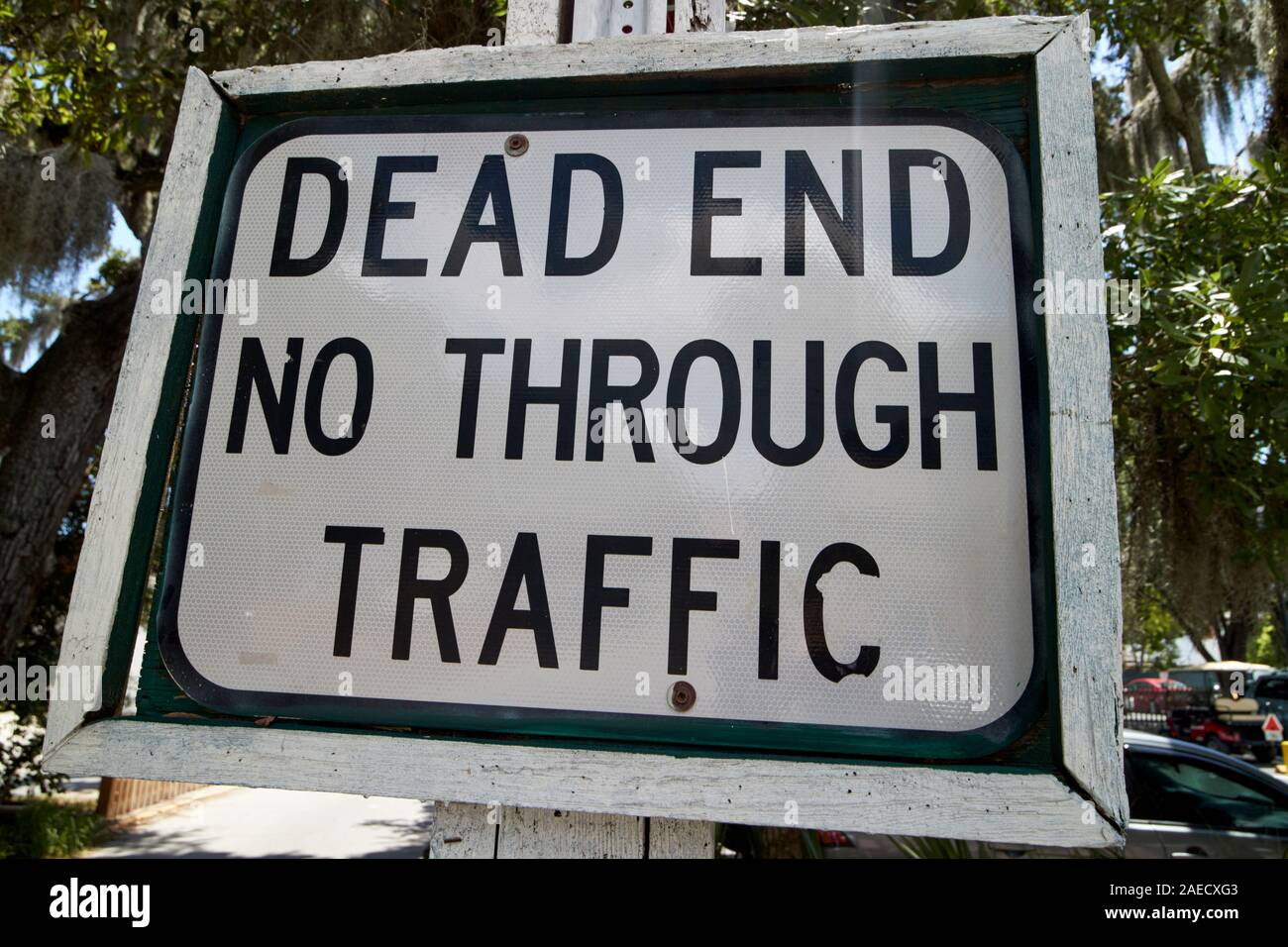modern dead end no through traffic sign mounted in a wooden frame to blend in with historic district st augustine florida usa Stock Photo