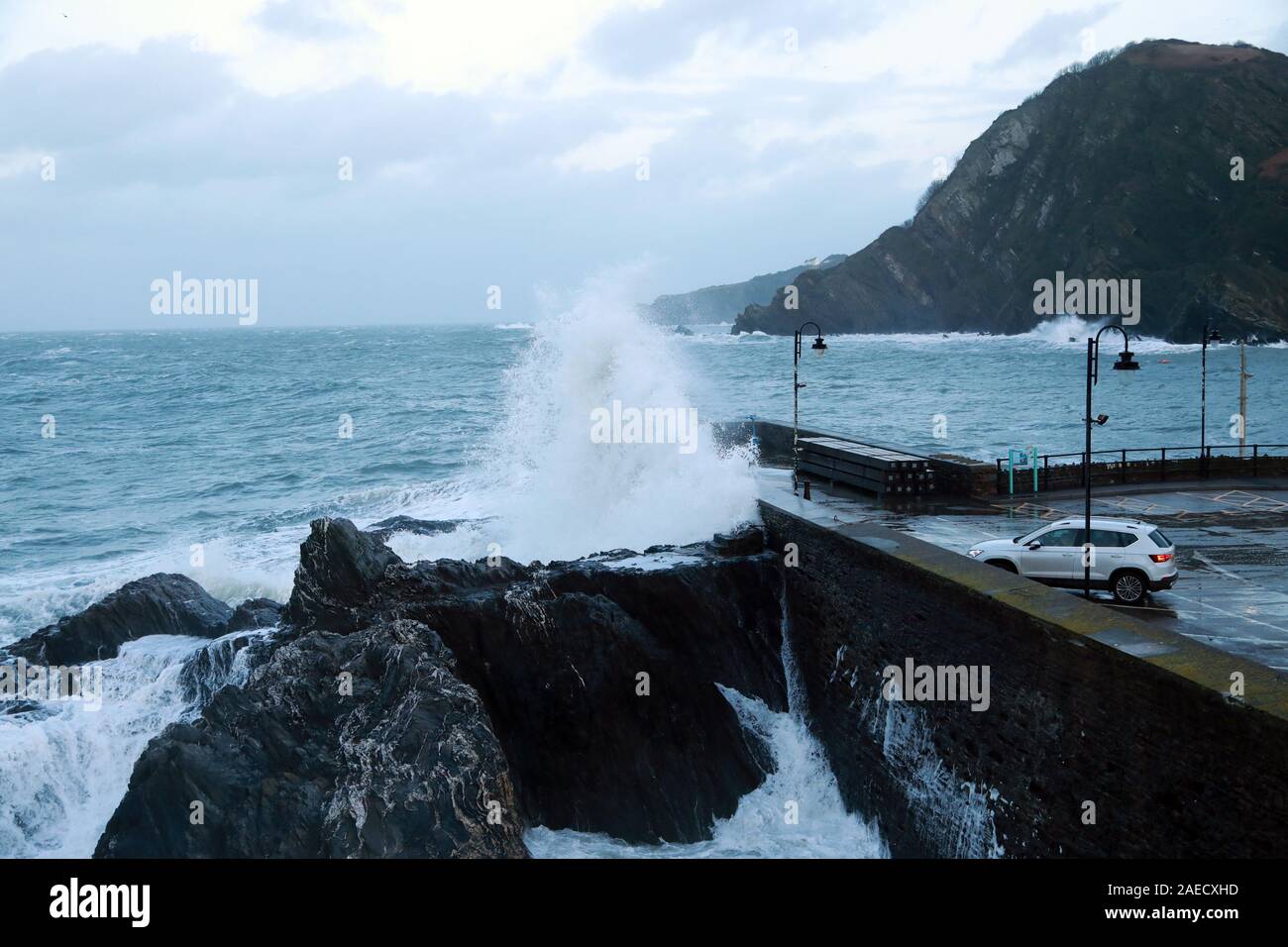 Ilfracombe, Devon, UK. 8th Dec, 2019. Storm Atiyah hits the coast of Ilfracombe, a seaside resort in North Devon, high winds and large waves batter the coastline. People come out to watch as the large waves hit the harbour walls. Credit: Natasha Quarmby/17�Թ����� Live News Stock Photo