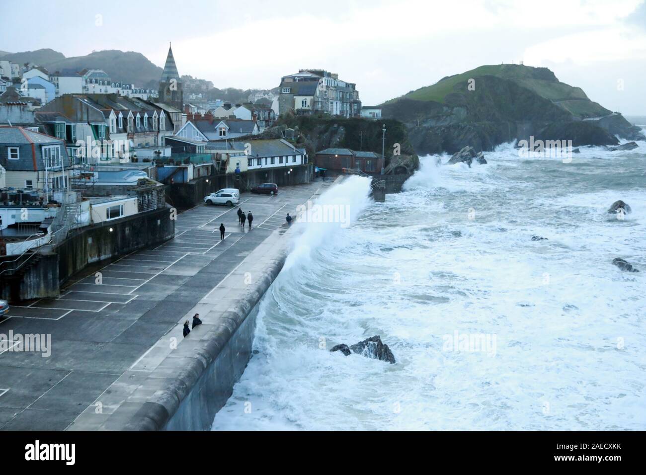 Ilfracombe, Devon, UK. 8th Dec, 2019. Storm Atiyah hits the coast of Ilfracombe, a seaside resort in North Devon, high winds and large waves batter the coastline. People come out to watch as the large waves hit the harbour walls. Credit: Natasha Quarmby/17�Թ����� Live News Stock Photo