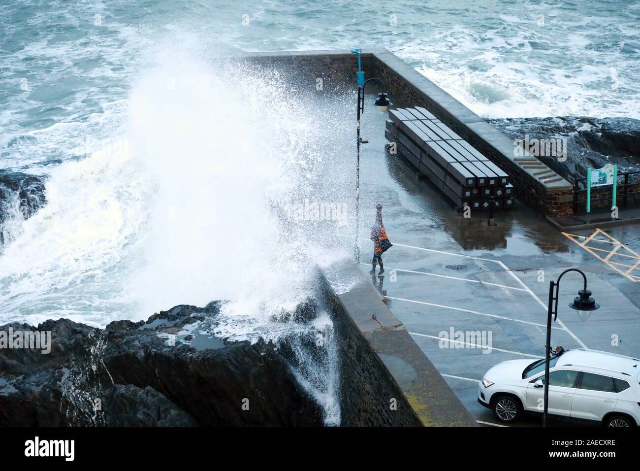 Ilfracombe, Devon, UK. 8th Dec, 2019. Storm Atiyah hits the coast of Ilfracombe, a seaside resort in North Devon, high winds and large waves batter the coastline. People come out to watch as the large waves hit the harbour walls. Credit: Natasha Quarmby/17�Թ����� Live News Stock Photo