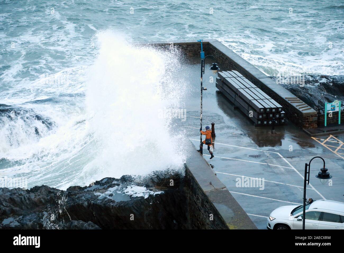 Ilfracombe, Devon, UK. 8th Dec, 2019. Storm Atiyah hits the coast of Ilfracombe, a seaside resort in North Devon, high winds and large waves batter the coastline. People come out to watch as the large waves hit the harbour walls. Credit: Natasha Quarmby/17�Թ����� Live News Stock Photo