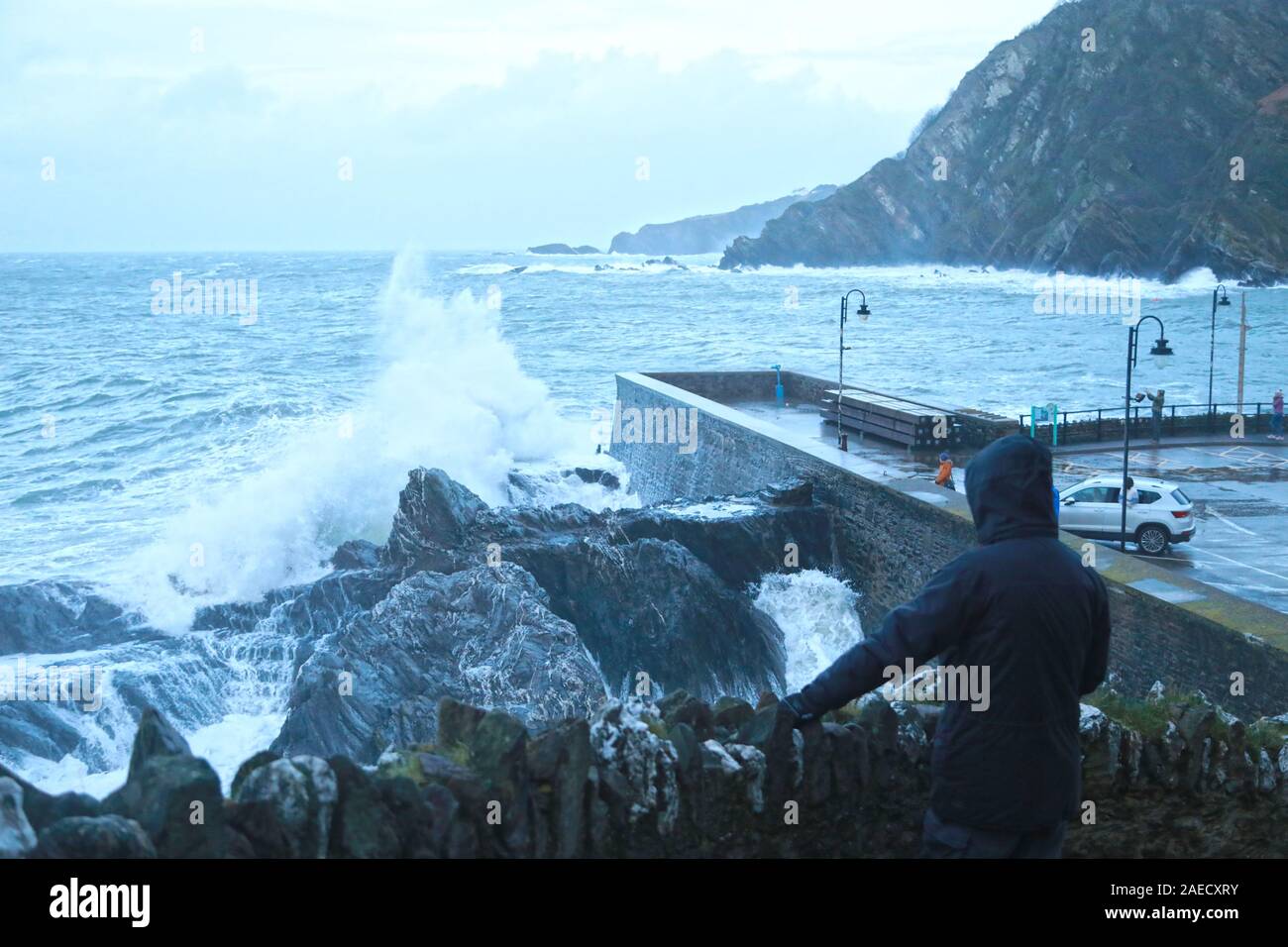 Ilfracombe, Devon, UK. 8th Dec, 2019. Storm Atiyah hits the coast of Ilfracombe, a seaside resort in North Devon, high winds and large waves batter the coastline. People come out to watch as the large waves hit the harbour walls. Credit: Natasha Quarmby/17�Թ����� Live News Stock Photo