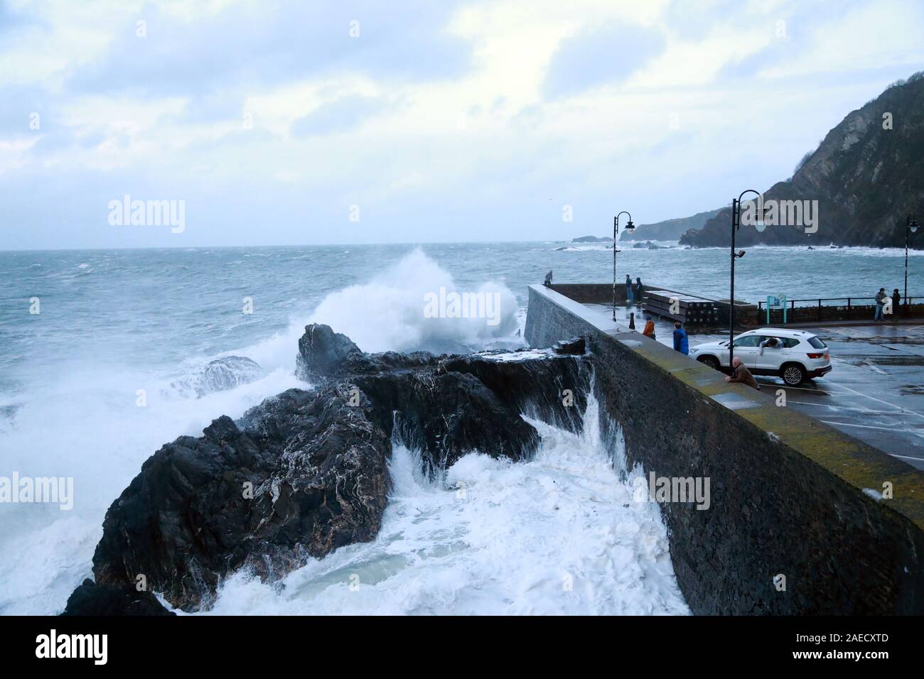 Ilfracombe, Devon, UK. 8th Dec, 2019. Storm Atiyah hits the coast of Ilfracombe, a seaside resort in North Devon, high winds and large waves batter the coastline. People come out to watch as the large waves hit the harbour walls. Credit: Natasha Quarmby/17�Թ����� Live News Stock Photo