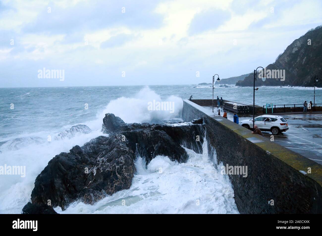 Ilfracombe, Devon, UK. 8th Dec, 2019. Storm Atiyah hits the coast of Ilfracombe, a seaside resort in North Devon, high winds and large waves batter the coastline. People come out to watch as the large waves hit the harbour walls. Credit: Natasha Quarmby/17�Թ����� Live News Stock Photo