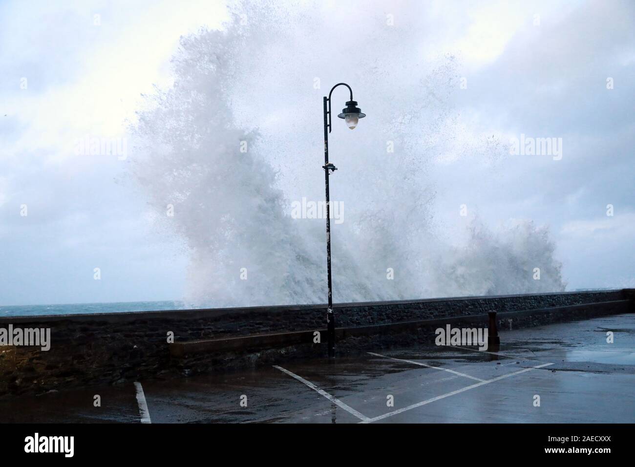 Ilfracombe, Devon, UK. 8th Dec, 2019. Storm Atiyah hits the coast of Ilfracombe, a seaside resort in North Devon, high winds and large waves batter the coastline. People come out to watch as the large waves hit the harbour walls. Credit: Natasha Quarmby/17�Թ����� Live News Stock Photo