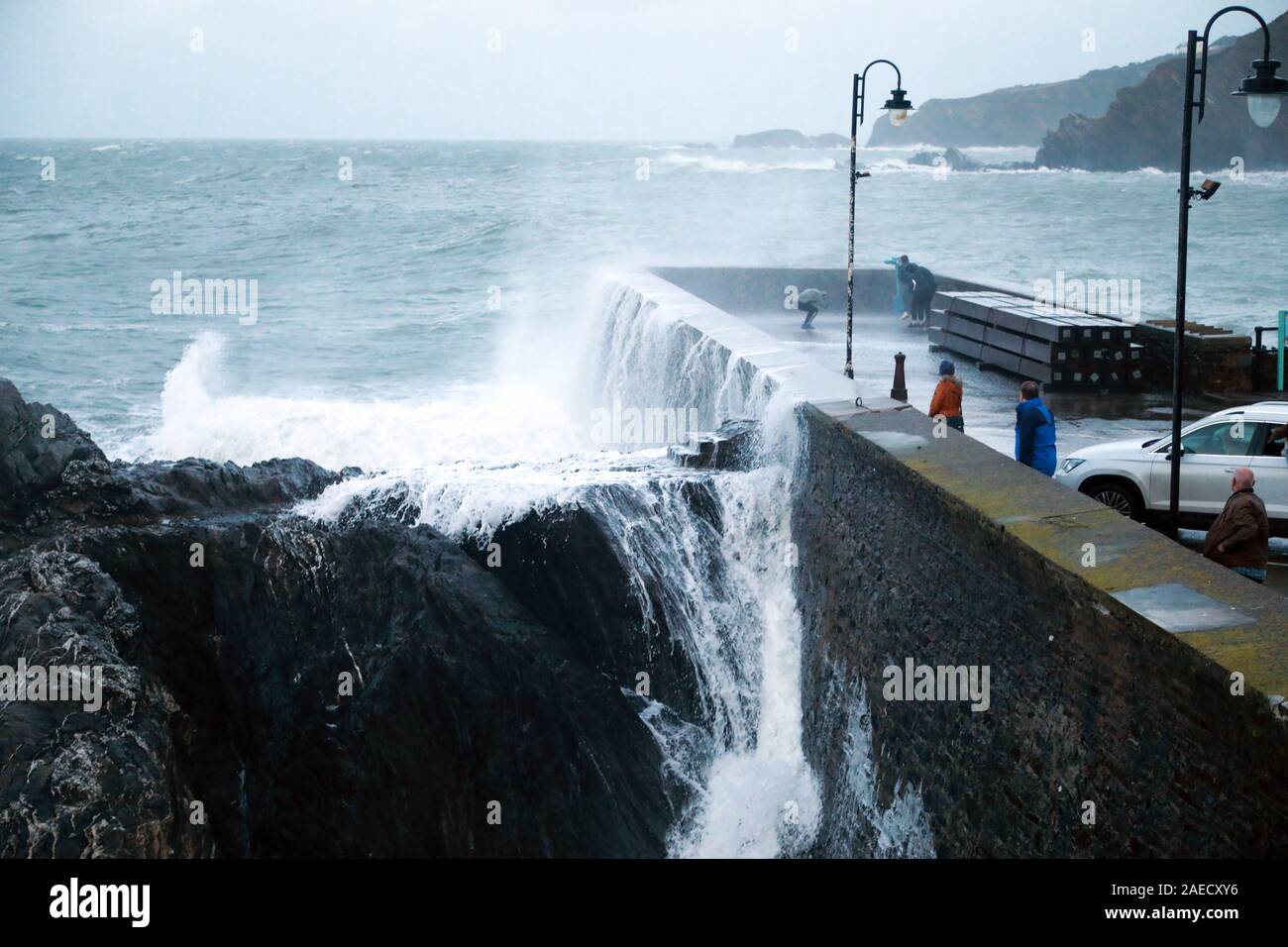 Ilfracombe, Devon, UK. 8th Dec, 2019. Storm Atiyah hits the coast of Ilfracombe, a seaside resort in North Devon, high winds and large waves batter the coastline. People come out to watch as the large waves hit the harbour walls. Credit: Natasha Quarmby/17�Թ����� Live News Stock Photo