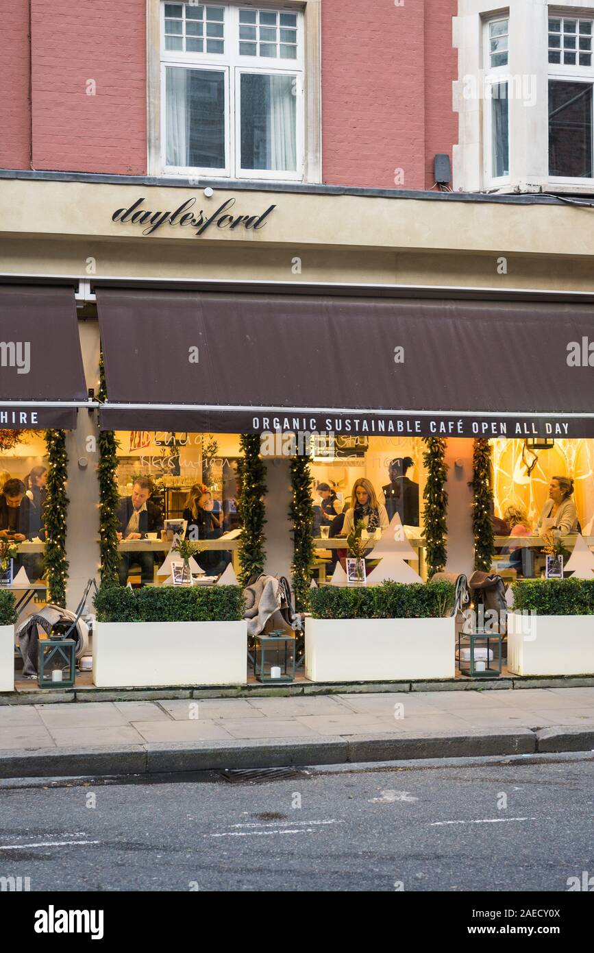 People relaxing and dining in Daylesford organic cafe, restaurant and shop, Blandford Street