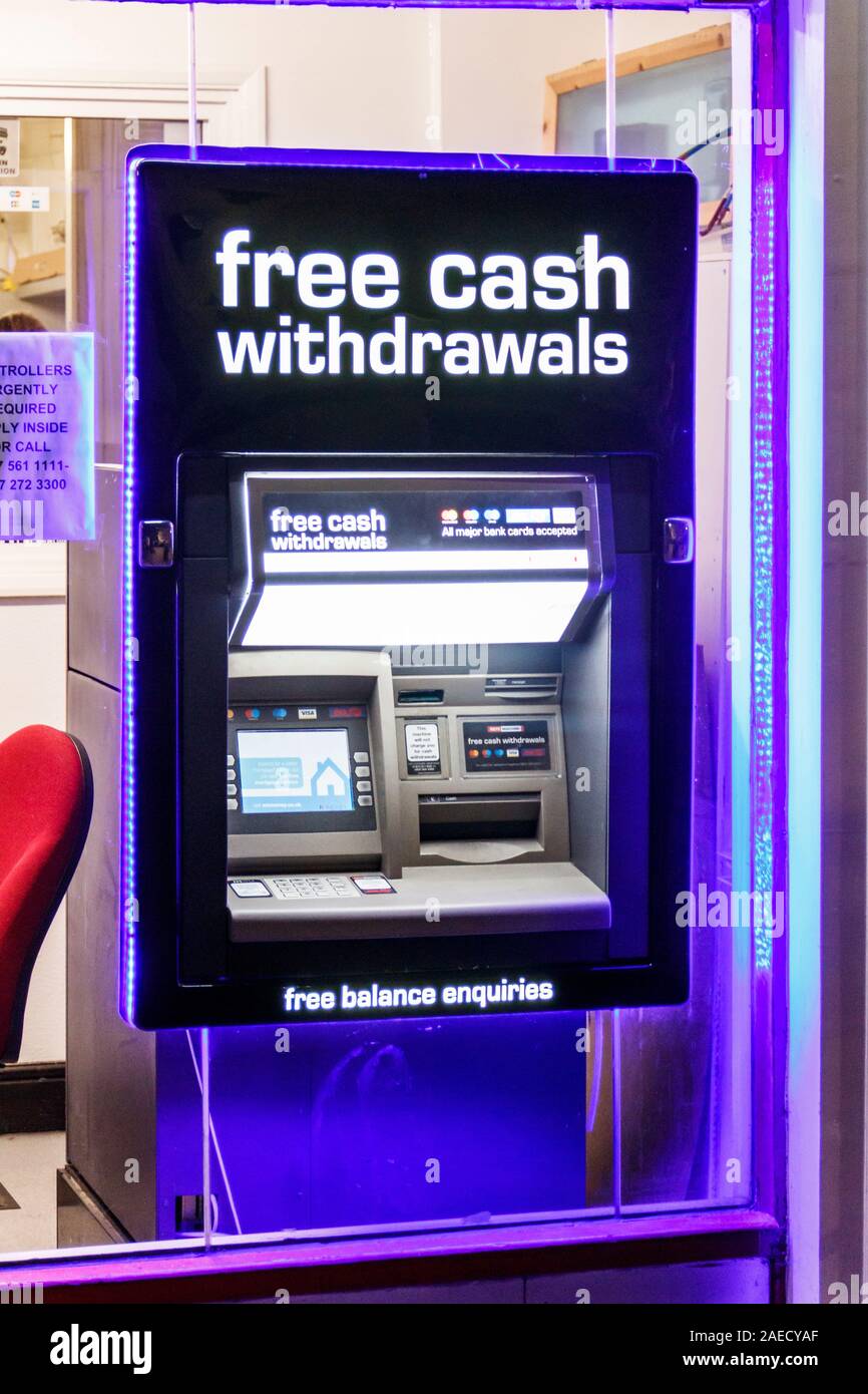 A cash withdrawal machine (ATM) set in the window of a shop in Archway, North London, UK Stock Photo