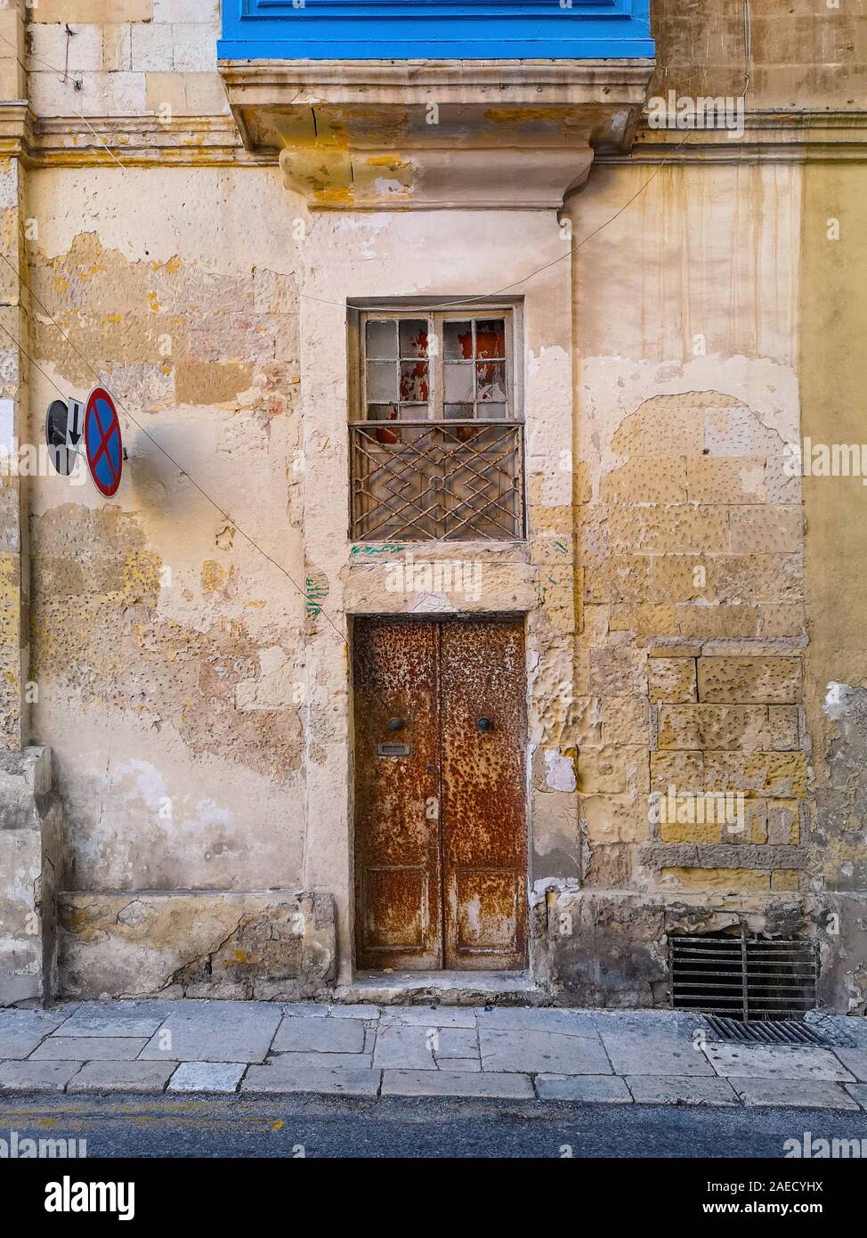 Maltese old house facade with iron door at Valletta, Malta Stock Photo