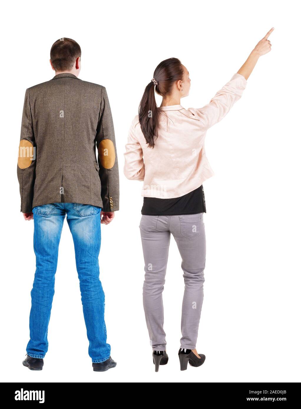 Back view of a stylish couple pointing. beautiful friendly girl and guy ...