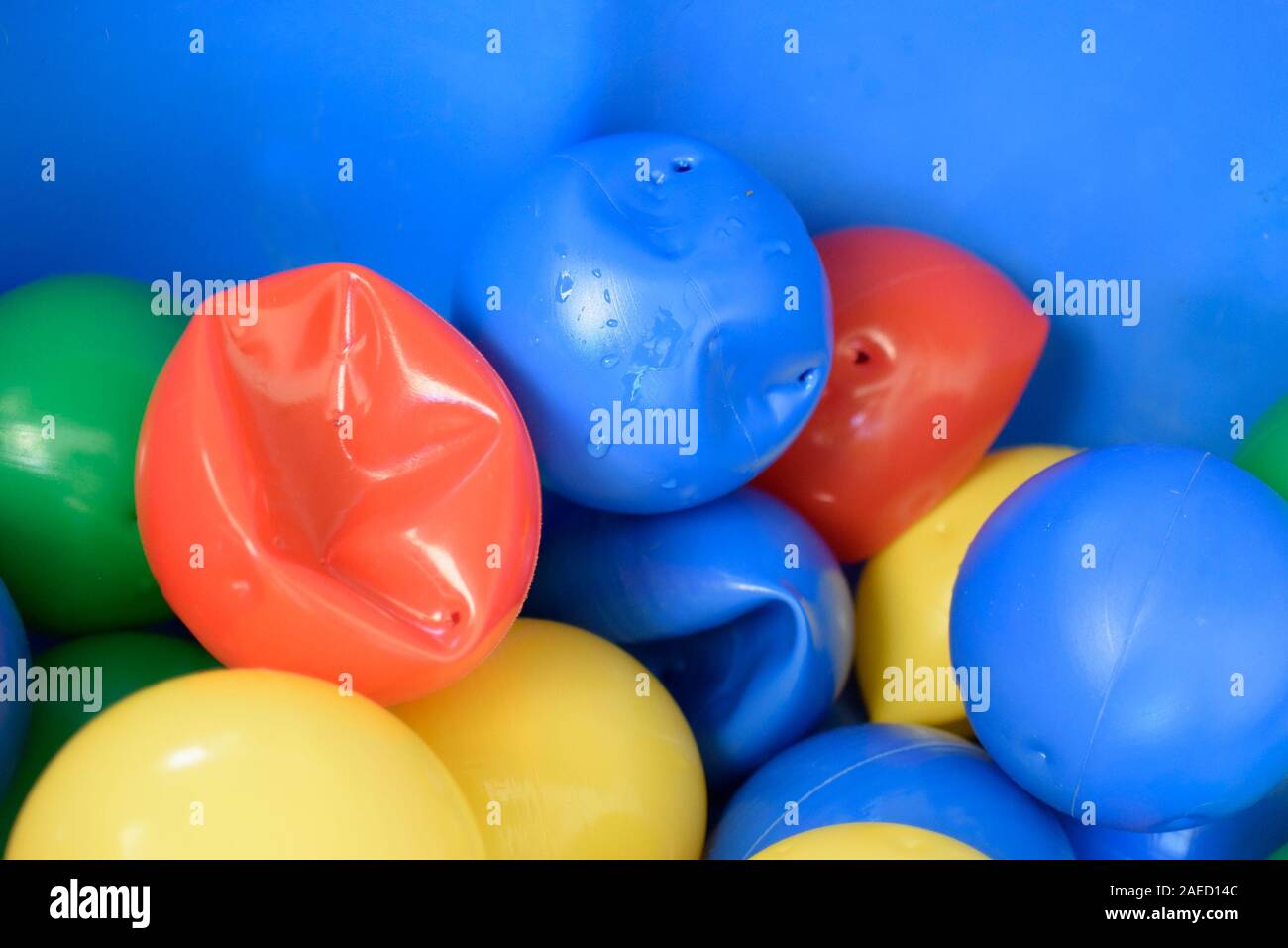 Cheap easily damaged colorful hollow plastic balls with holes for ball pit  Stock Photo - Alamy