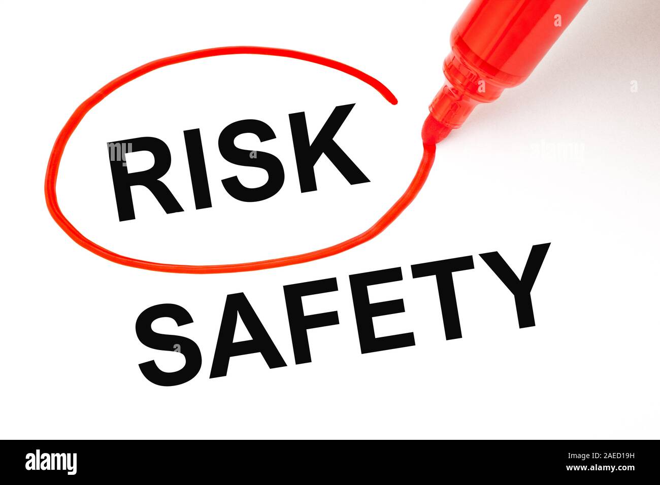 Concept about choosing to take a Risk instead of Safety. Word Risk picked with red marker over the word Safety. Stock Photo