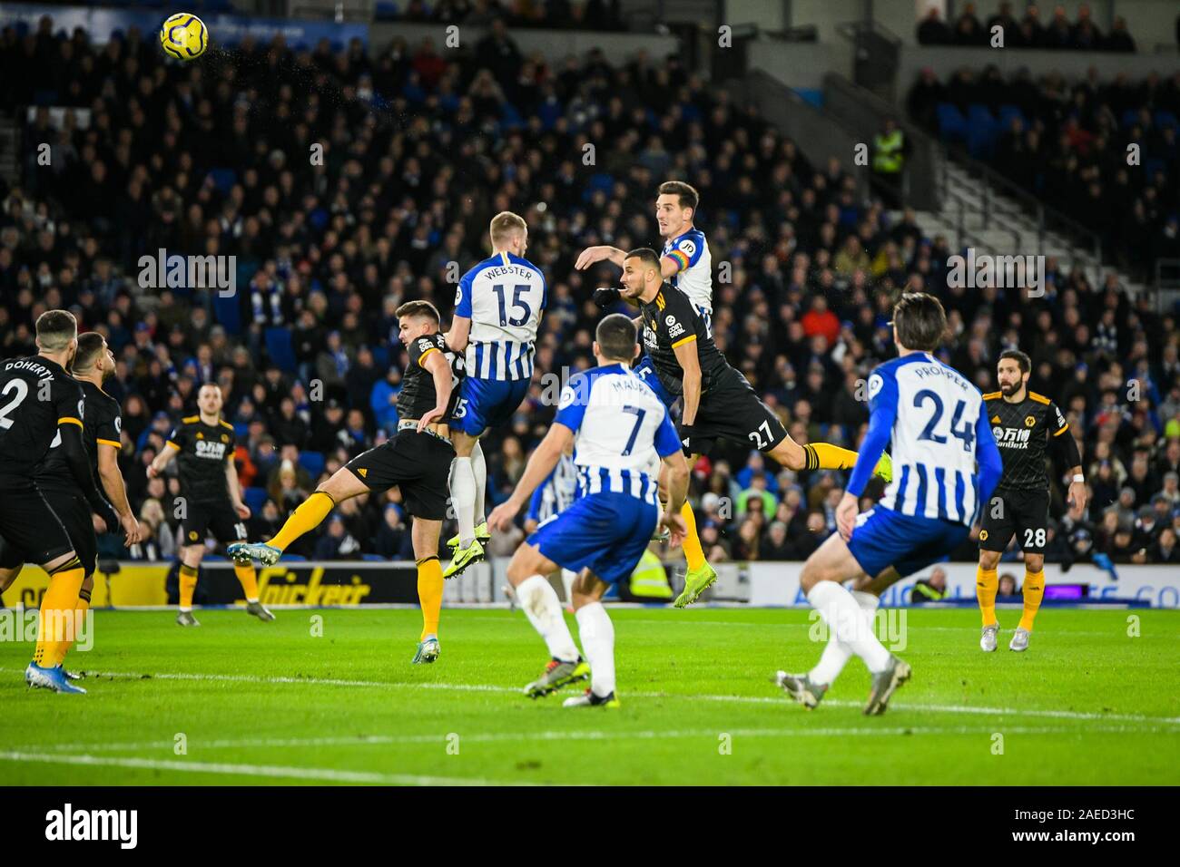 Brighton And Hove, UK. 08th Dec, 2019. Lewis Dunk of Brighton & Hove Albion (5) jumps high to head a corner goal wards during the Premier League match between Brighton and Hove Albion and Wolverhampton Wanderers at the American Express Community Stadium, Brighton and Hove, England on 8 December 2019. Photo by Edward Thomas/PRiME Media Images. Credit: PRiME Media Images/Alamy Live News Stock Photo