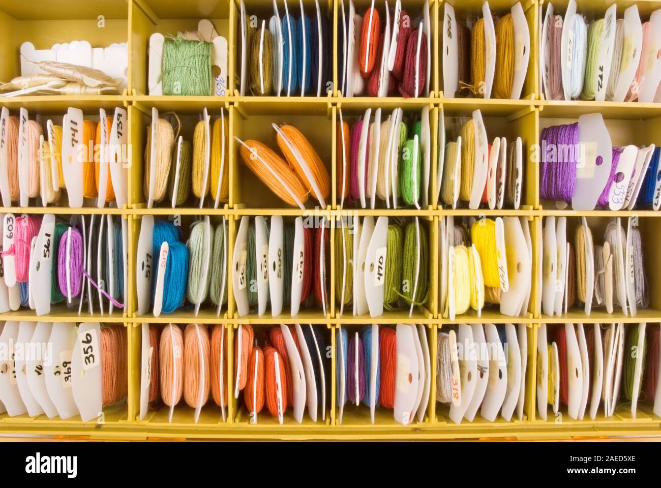 Assorted colors of cross stitch embroidery floss on plastic numbered