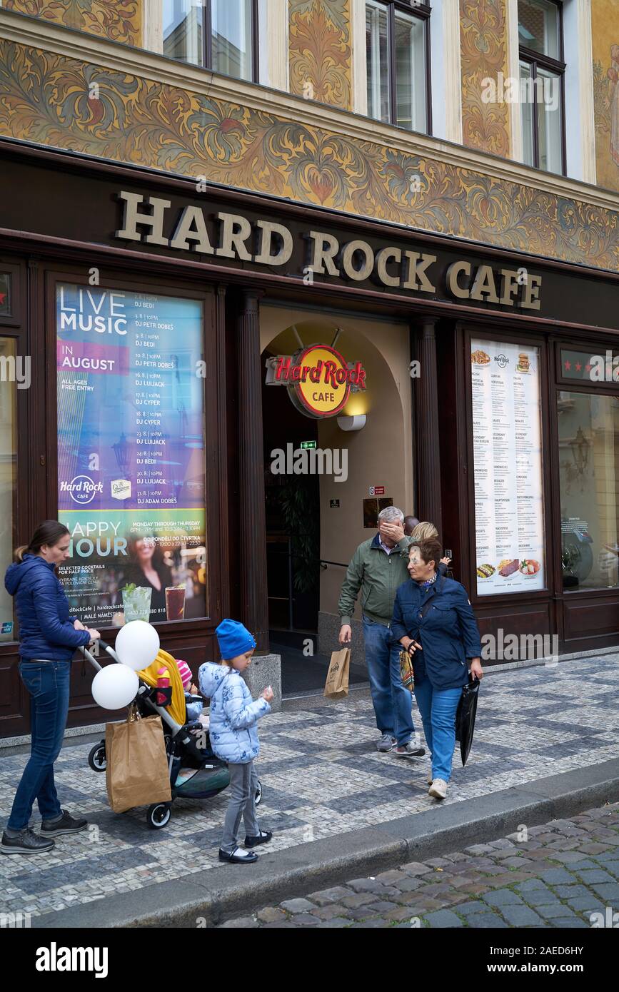 Tourists in front of the popular Hard Rock Cafe in the historic house "U Rotta" in the Old Town of Prague. Stock Photo