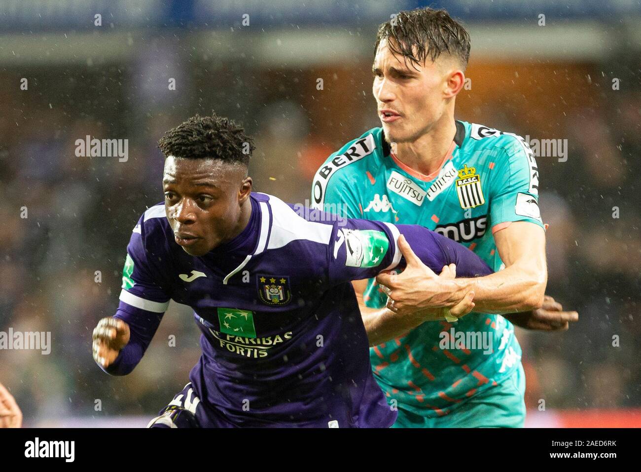 BRUSSELS, BELGIUM - December 08: Jeremy Doku of Anderlecht and Maxime Busi  of Charleroi fight for the ball during the Jupiler Pro League match day 18  between Rsc Anderlecht vs Sporting Charleroi