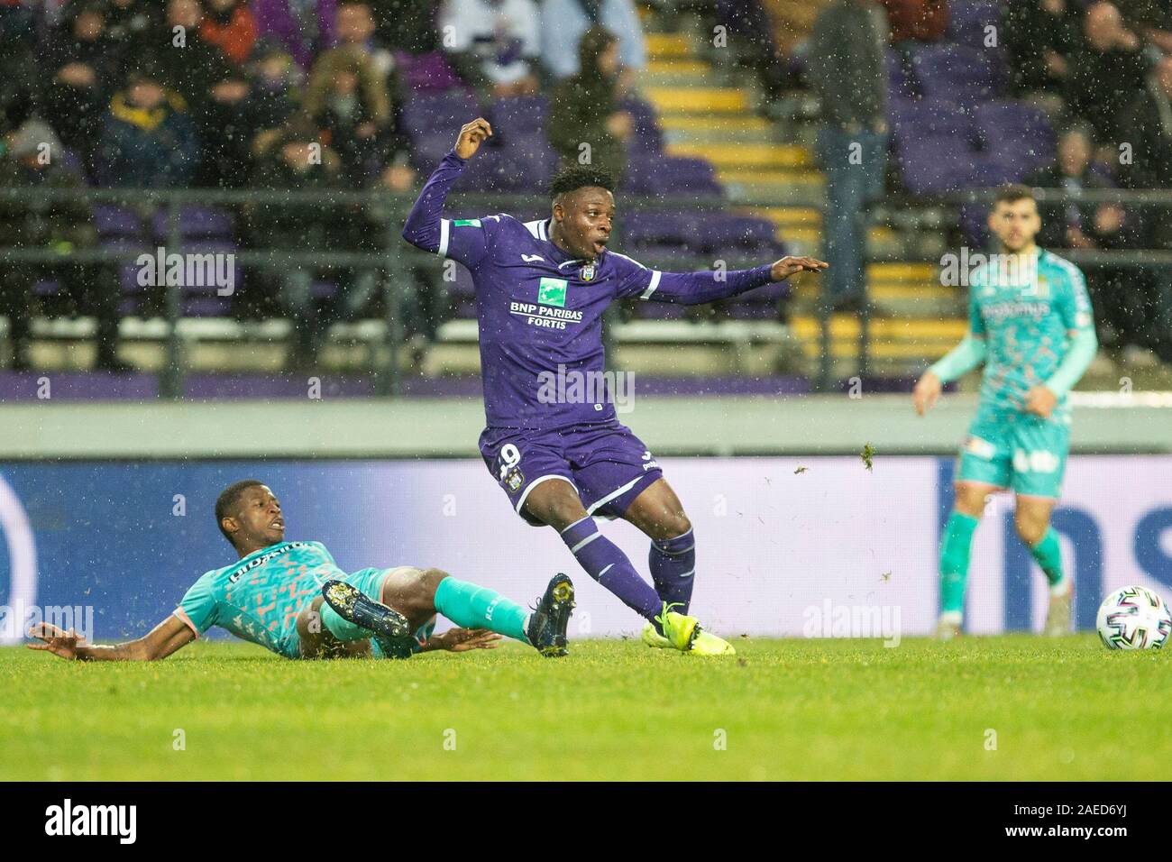 BRUSSELS, BELGIUM - December 08: Jeremy Doku of Anderlecht and Maxime Busi  of Charleroi fight for the ball during the Jupiler Pro League match day 18  between Rsc Anderlecht vs Sporting Charleroi