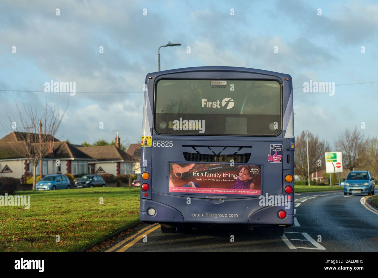 First Group, FirstGroup, First Essex bus with London Women's Clinic fertility advertisement, advert, on the back. Driving on road. Old diesel bus Stock Photo