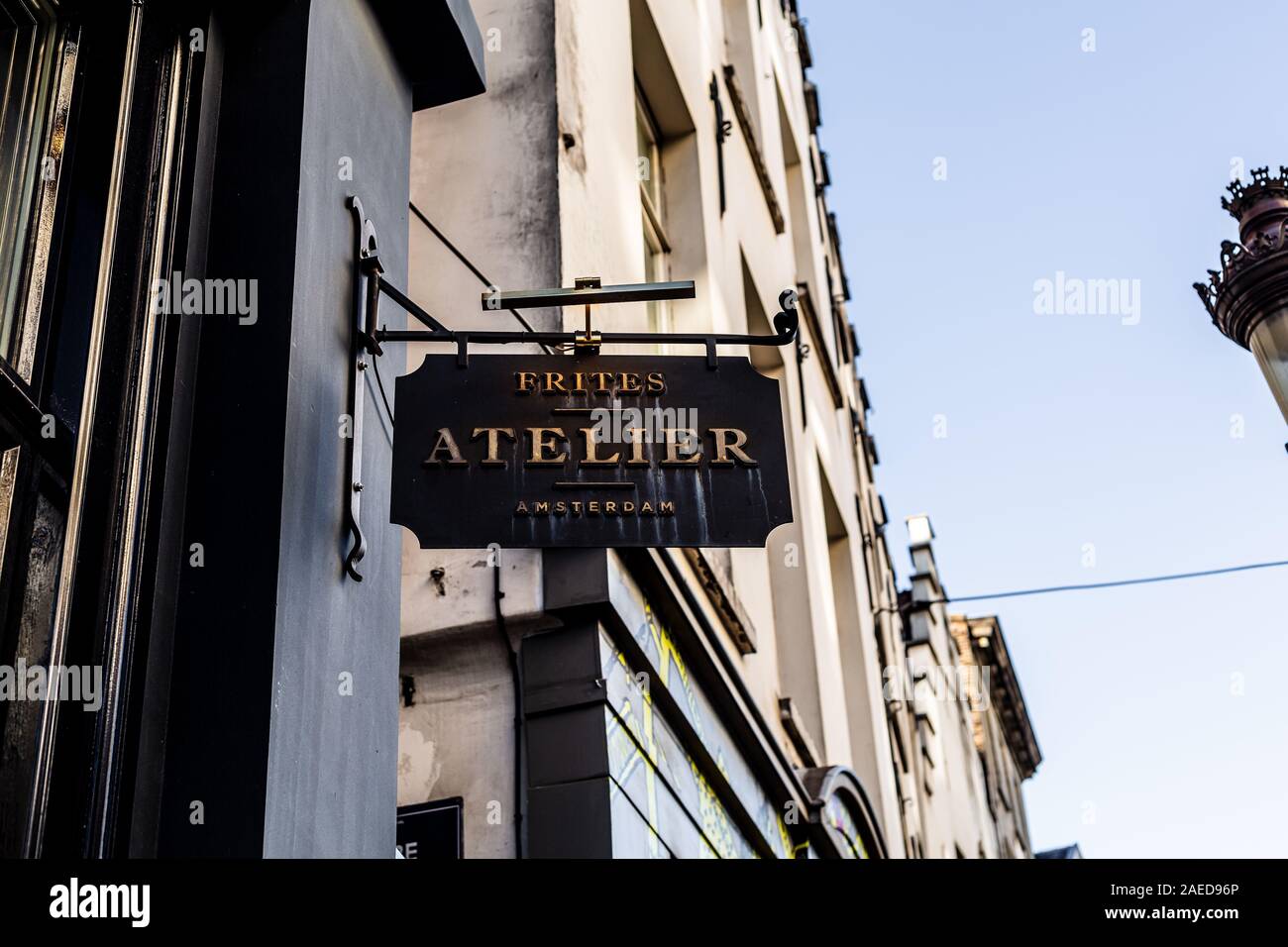 Restaurant sign on a city street storefront, Brussels, Belgium Stock Photo