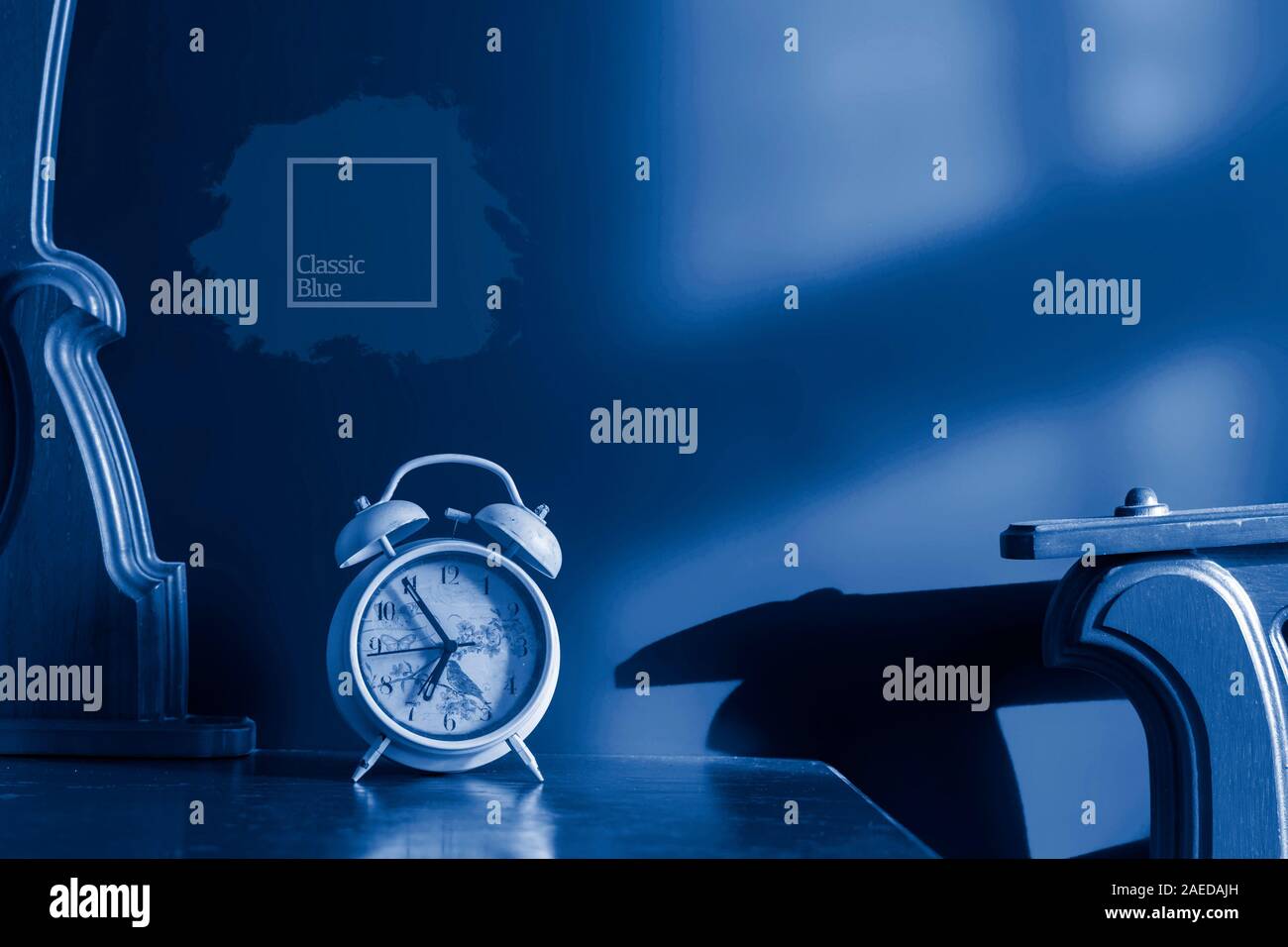 white retro alarm clock on nightstand at morning f Stock Photo Alamy