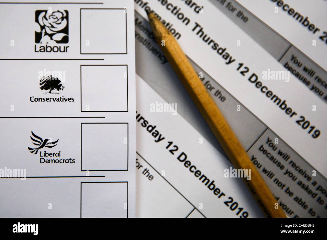 In this photo illustration, a ballot Paper seen displayed showing logos of Labour Party, Conservative Party and Liberal Democrats. Stock Photo