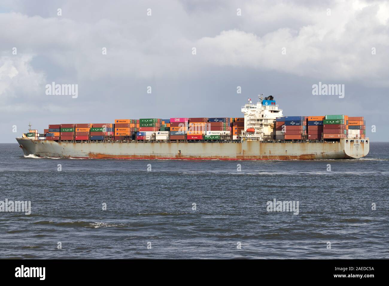 Fukujin Kisen container ship LILA LONDON on the river Elbe. Stock Photo