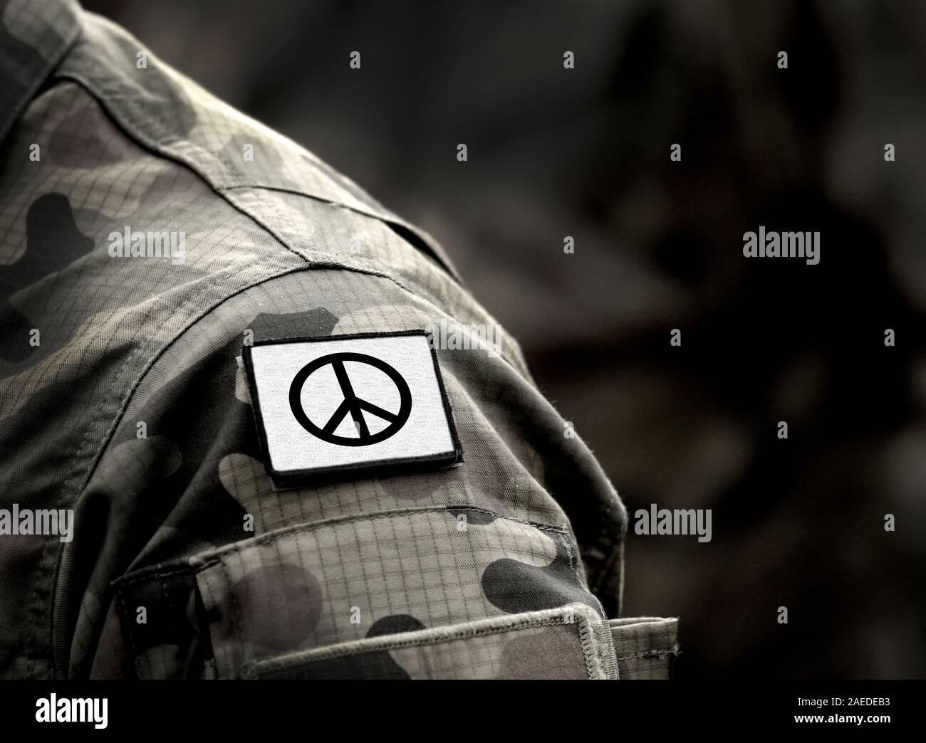 Peace sign on military uniform. The Peace symbol. Peace and war. Stock Photo