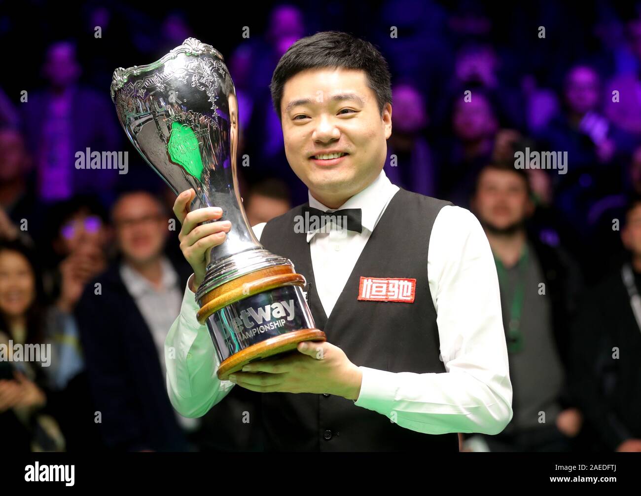 Ding Junhui celebrates with the trophy after winning the Betway UK Championship at the York Barbican. Stock Photo