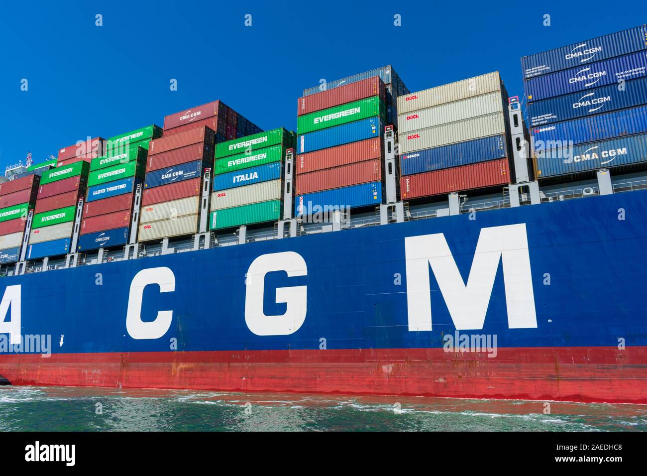 Colorful cargo shipping containers stacked aboard of French container