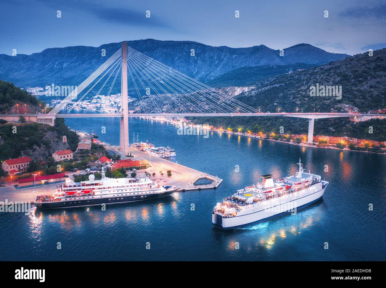 Aerial view of cruise ship at harbor and bridge at night Stock Photo ...