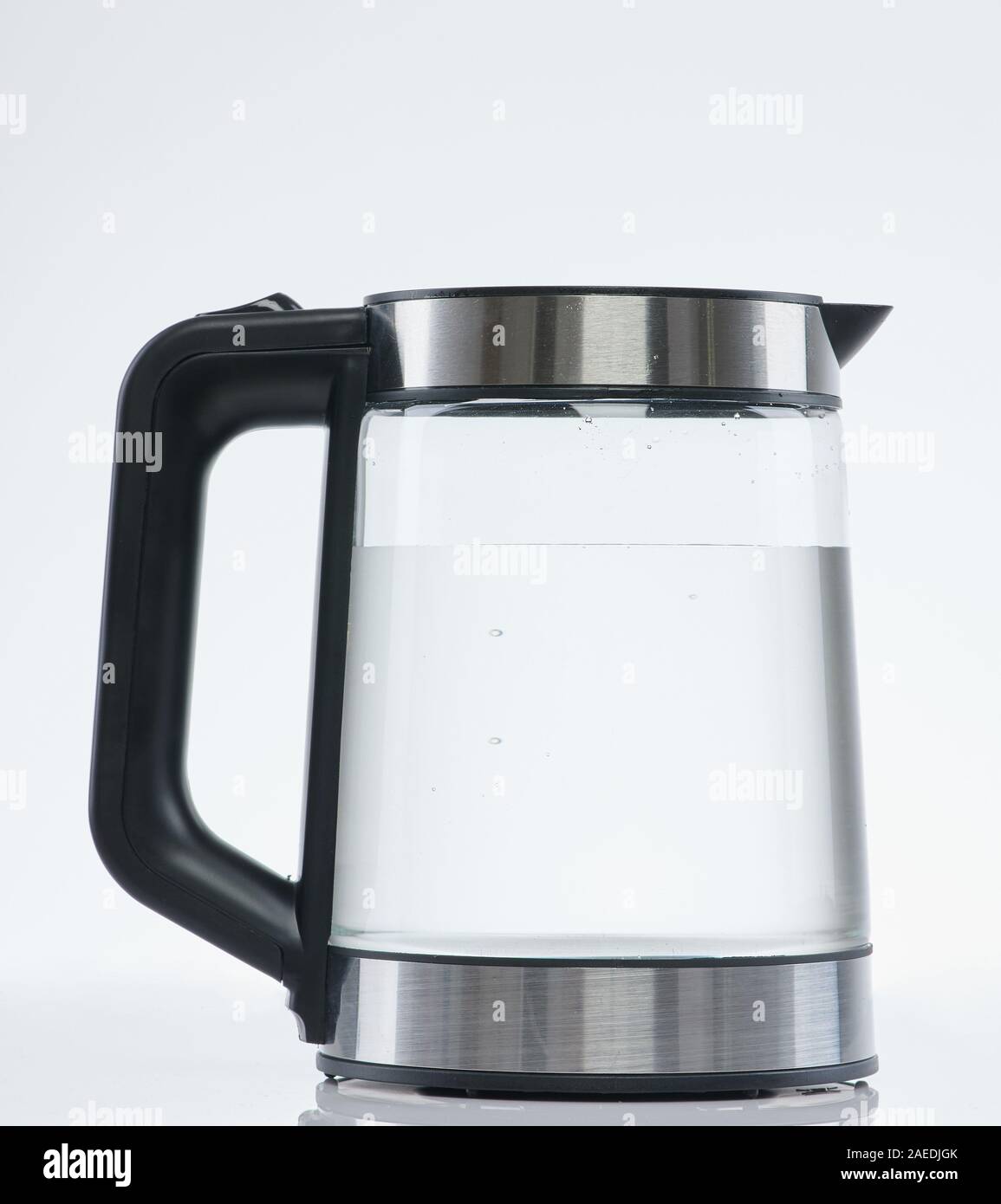 Clean water in transparent kettle isolated on white studio background Stock Photo